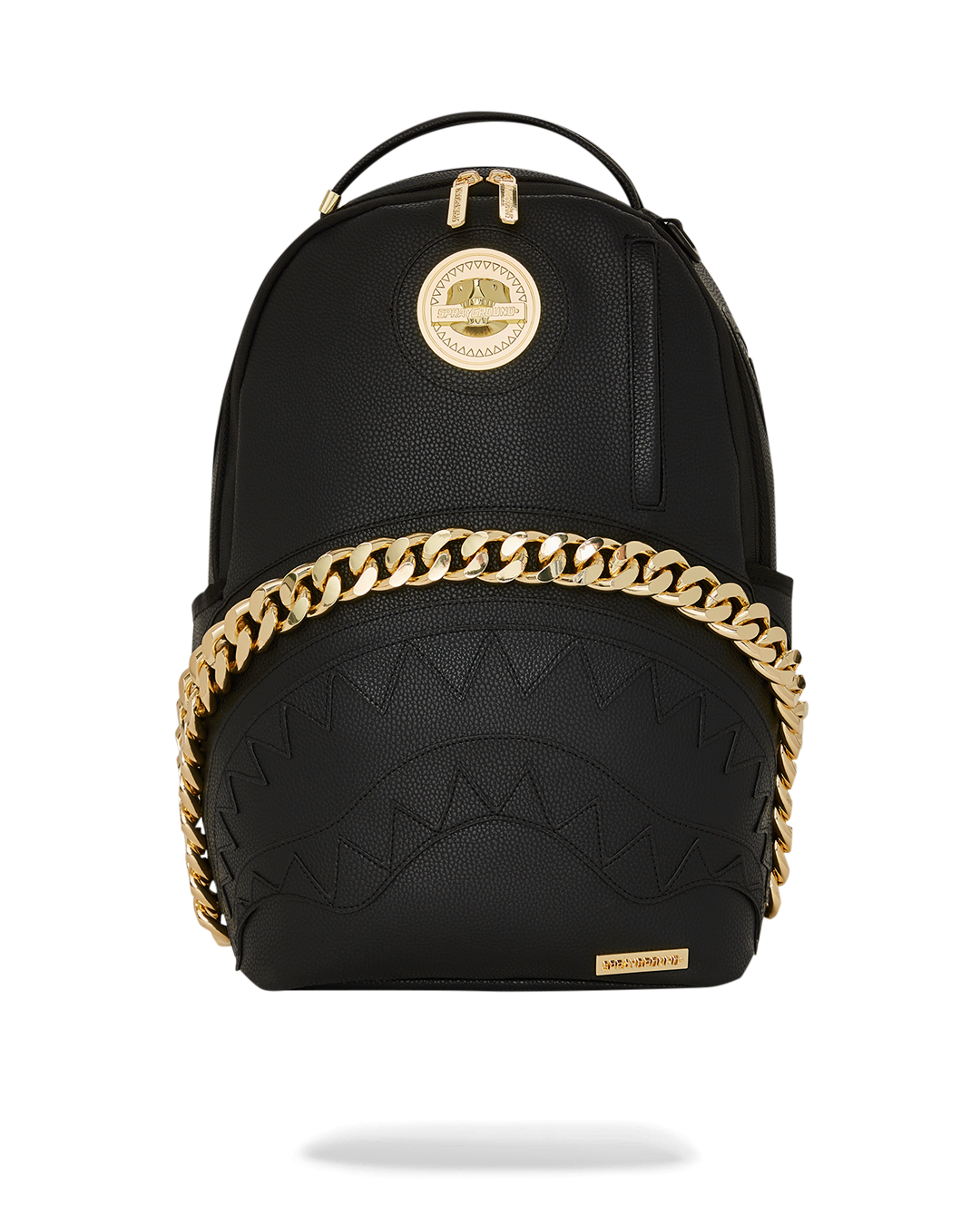The Champ Backpack front view showcasing gold chain details and shark emblem