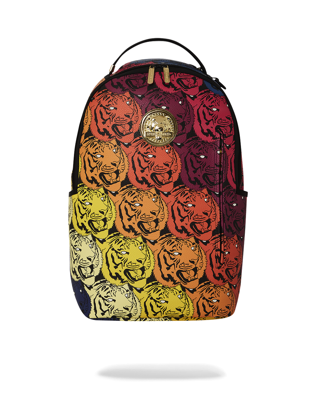 Close-up of gold tiger emblem on black faux leather backpack