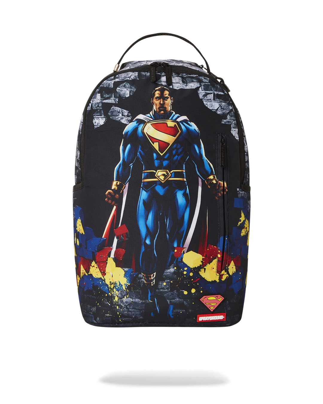 Front view of pink Sprayground backpack with Superman logo and side pockets