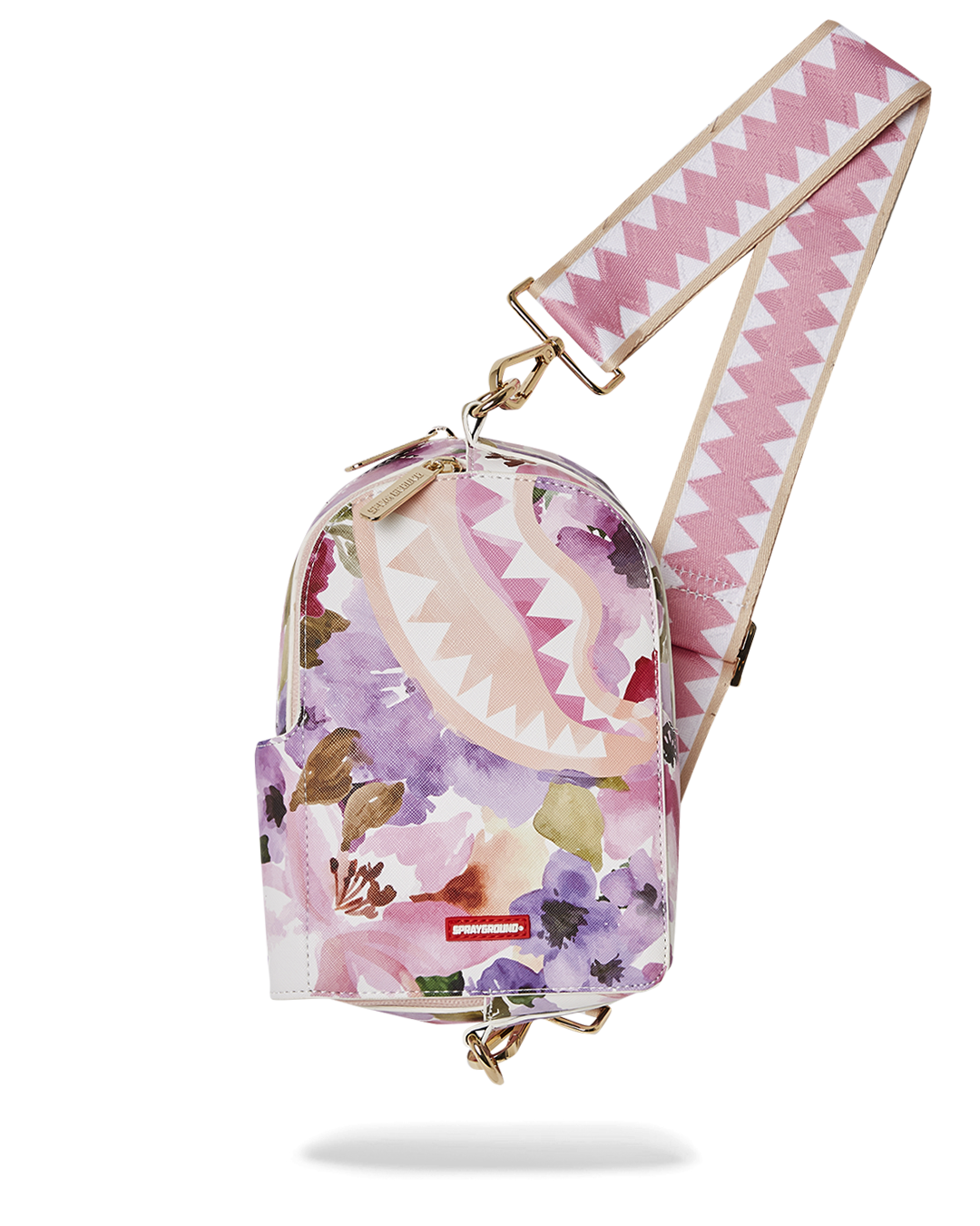 Close-up of the faux leather sling bag's zippered compartments.