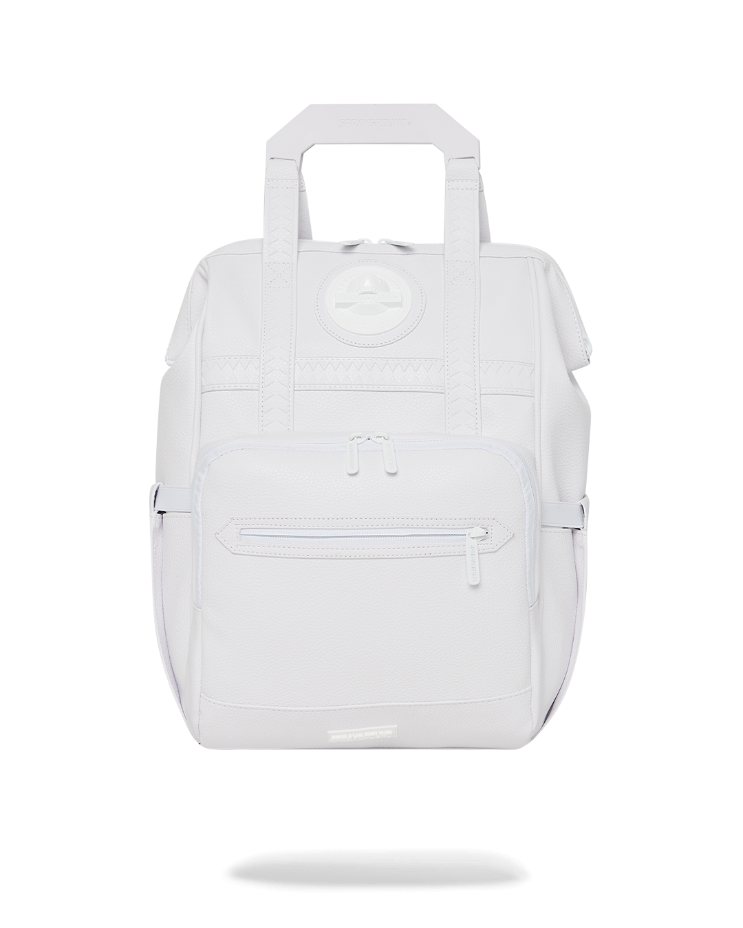 Angled front view of faux leather mini backpack showing shark logo hardware