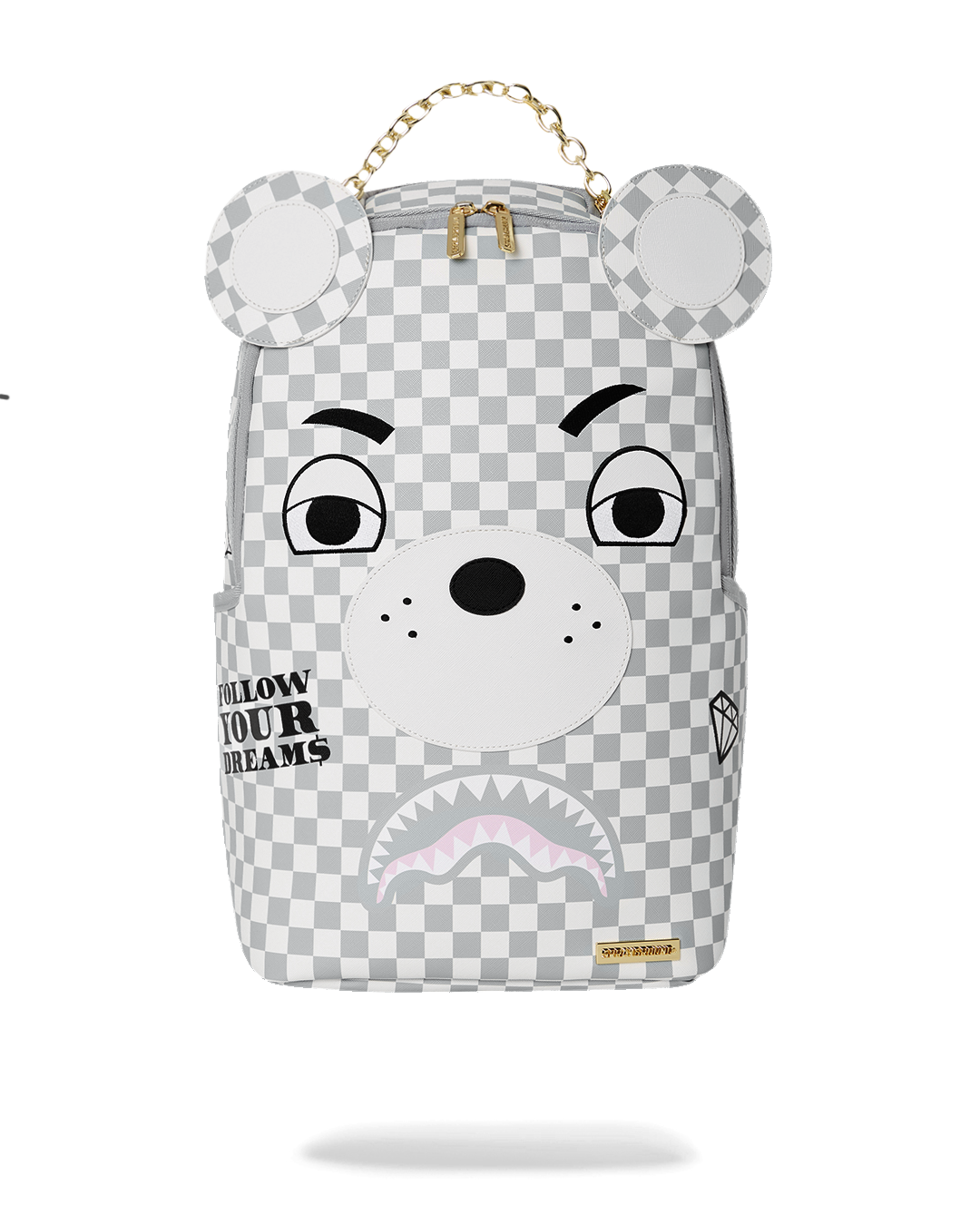 Pink Sprayground bear backpack worn by a traveler in a city