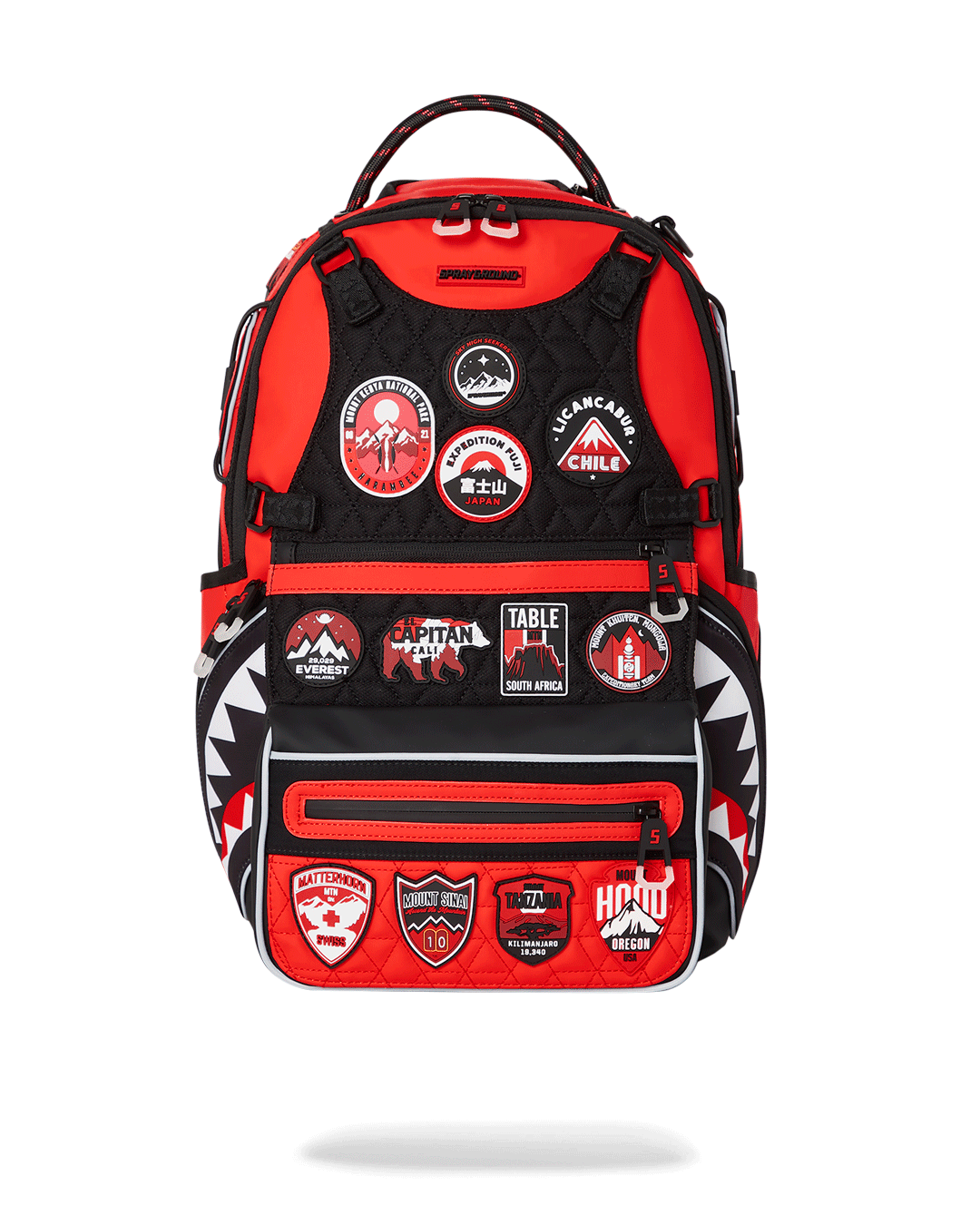 Front view of Shark Glider Adventure Backpack with mountain patches