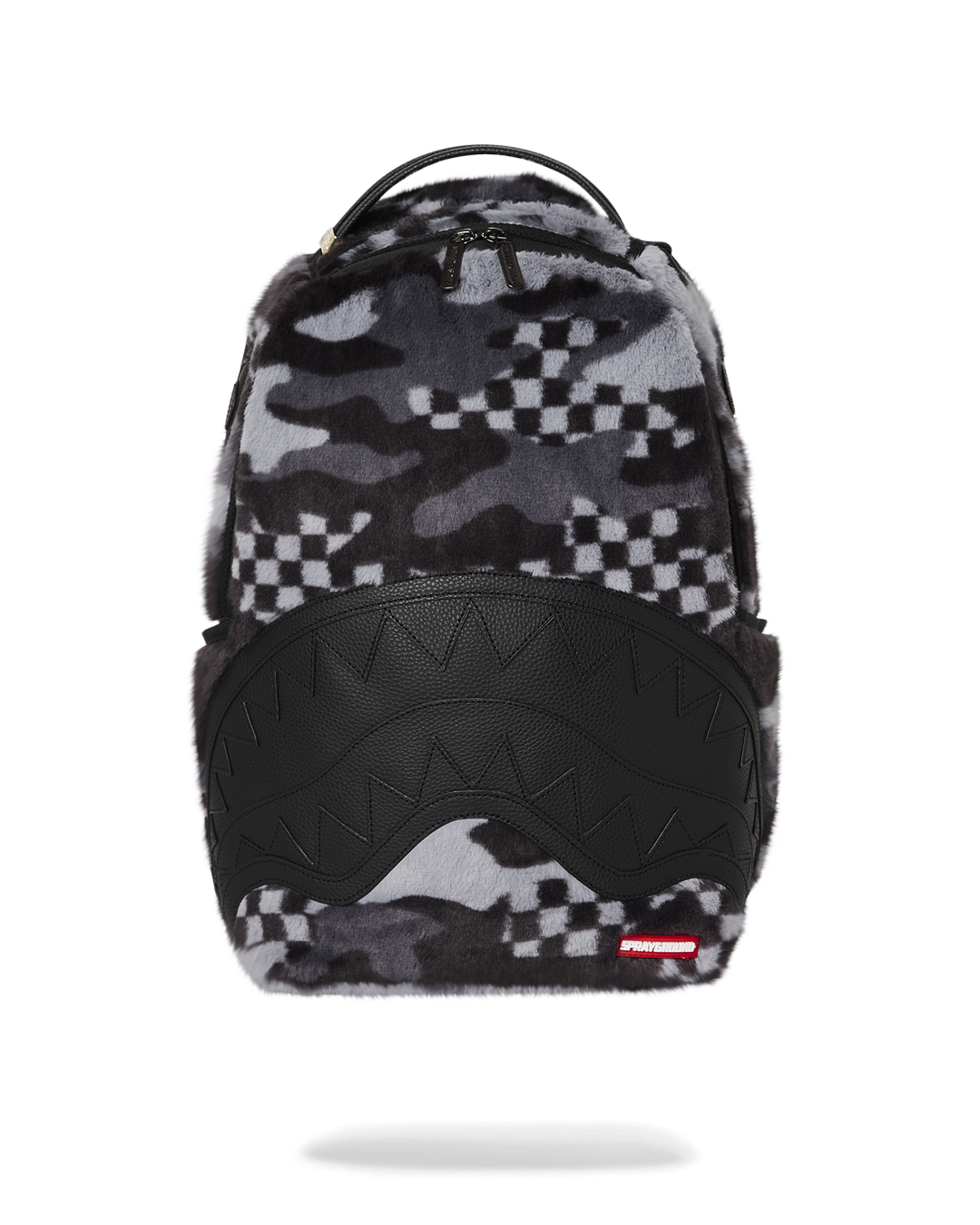 Close-up of the faux fur exterior of the plush backpack with gold zippers