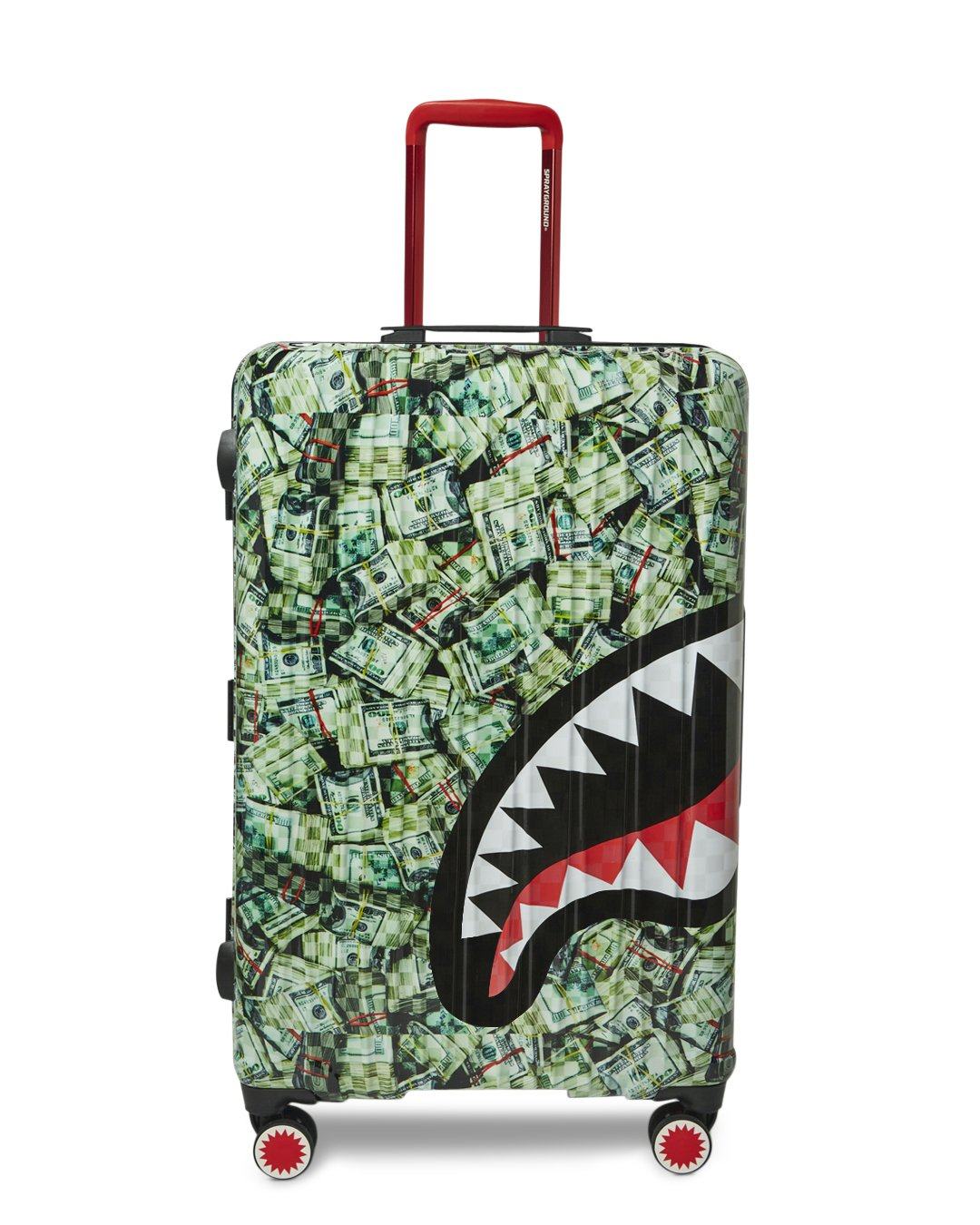 Sharkitecture luggage upright at airport with telescoping handle extended