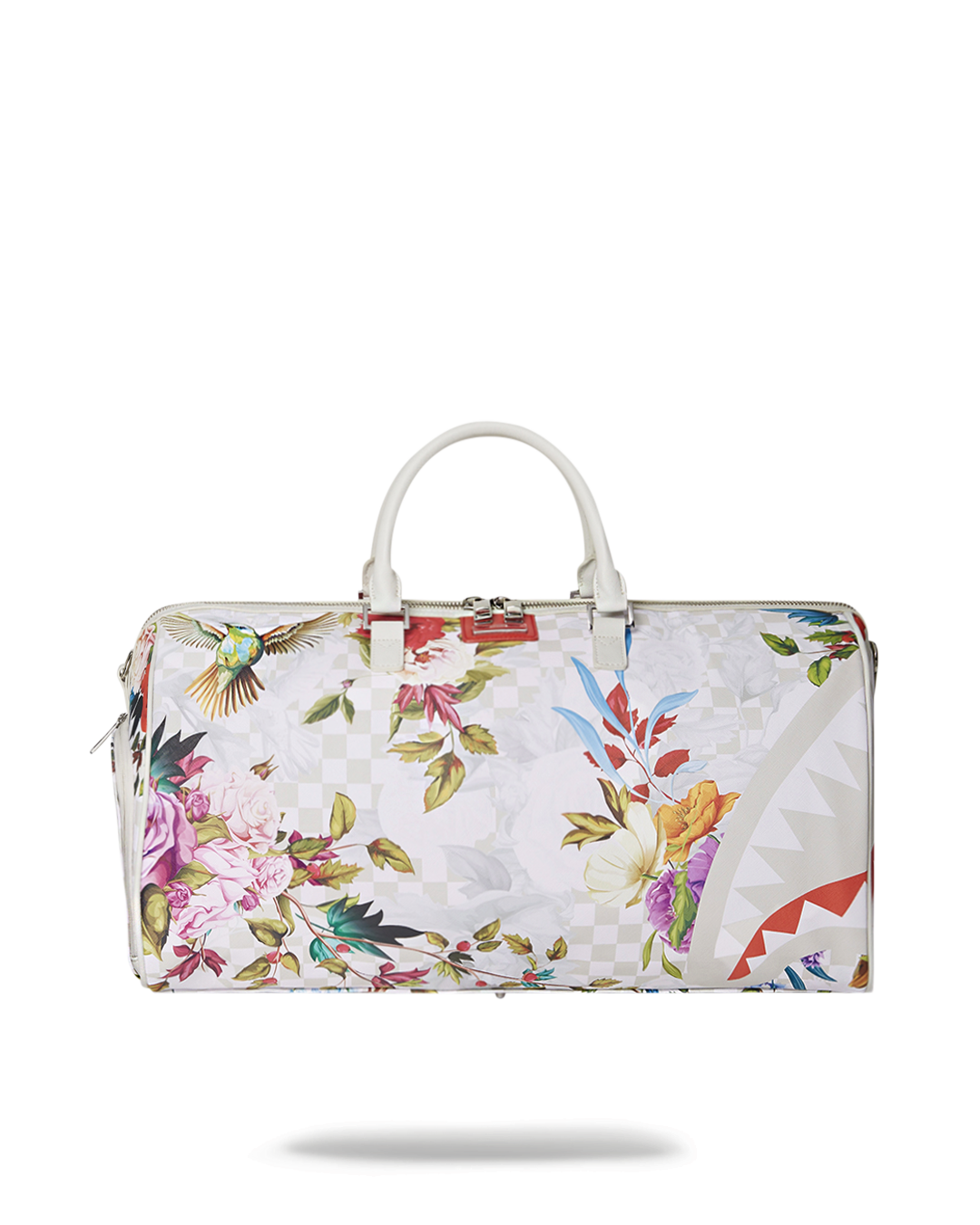 Elegant vegan leather duffle bag with adjustable straps at a scenic park.