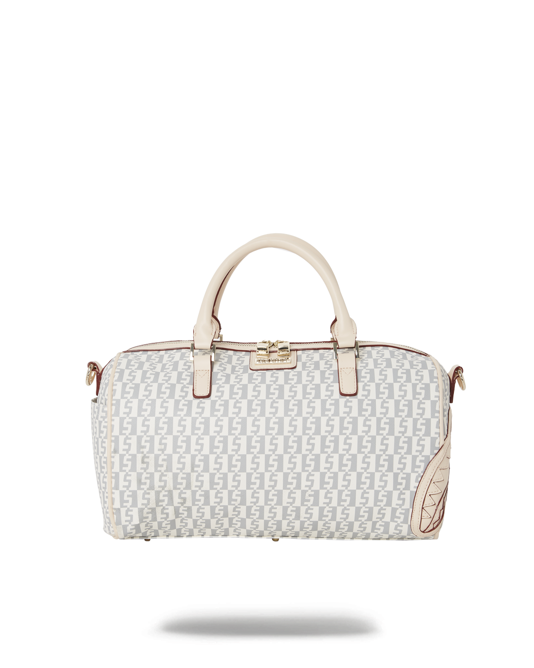 Front view of the faux leather crossbody bag with gold zippers on a city sidewalk.