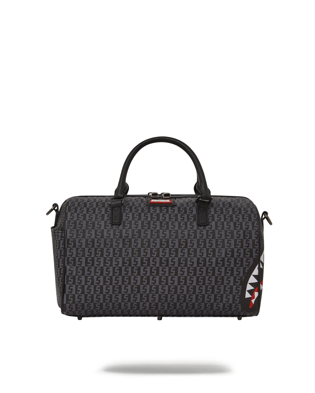 Sprayground faux leather bag worn as a crossbody purse in urban setting