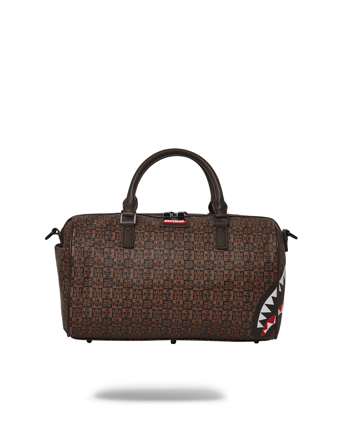 Frenzy Sharks mini duffle bag held by handle, showcasing sleek vegan leather texture