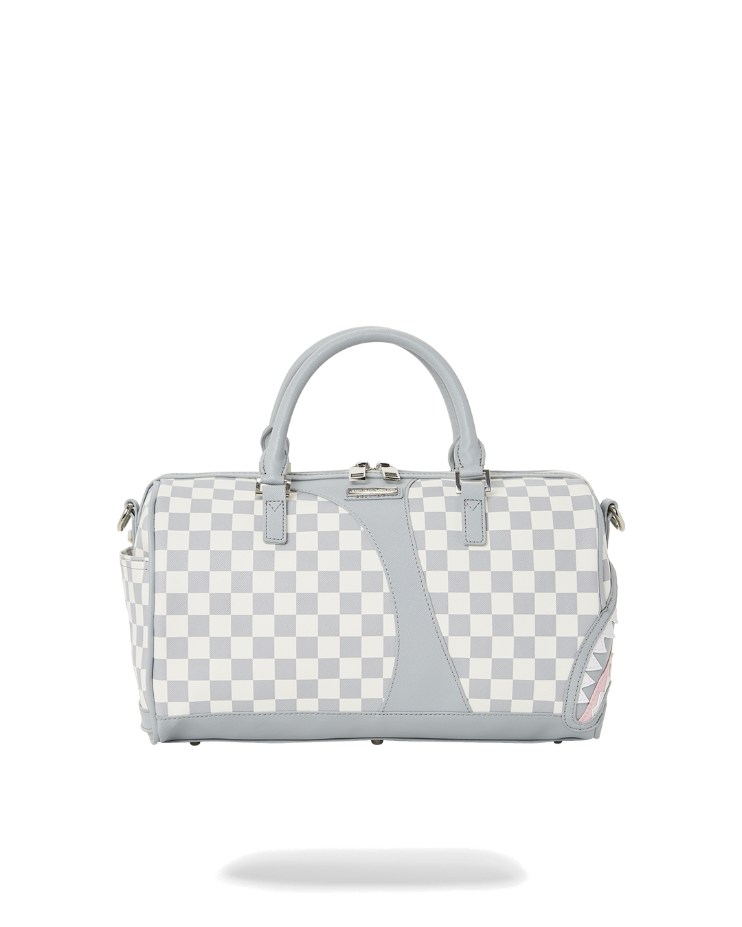 Black faux leather mini duffle bag with gold zippers on a cobblestone street