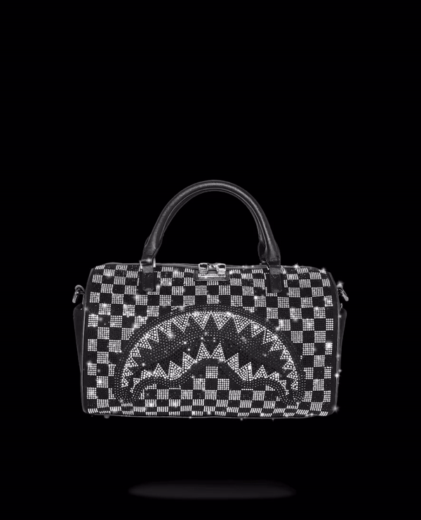 Mini duffle bag with crystal embellishment and faux leather construction, showcasing its stylish design.