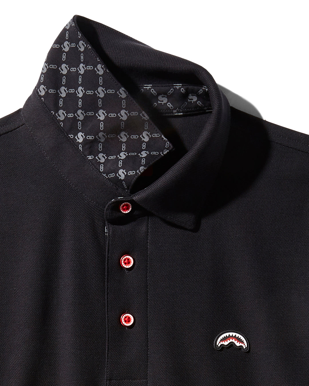 Front view of men's pima cotton polo with sharkmouth logo, worn casually outdoors