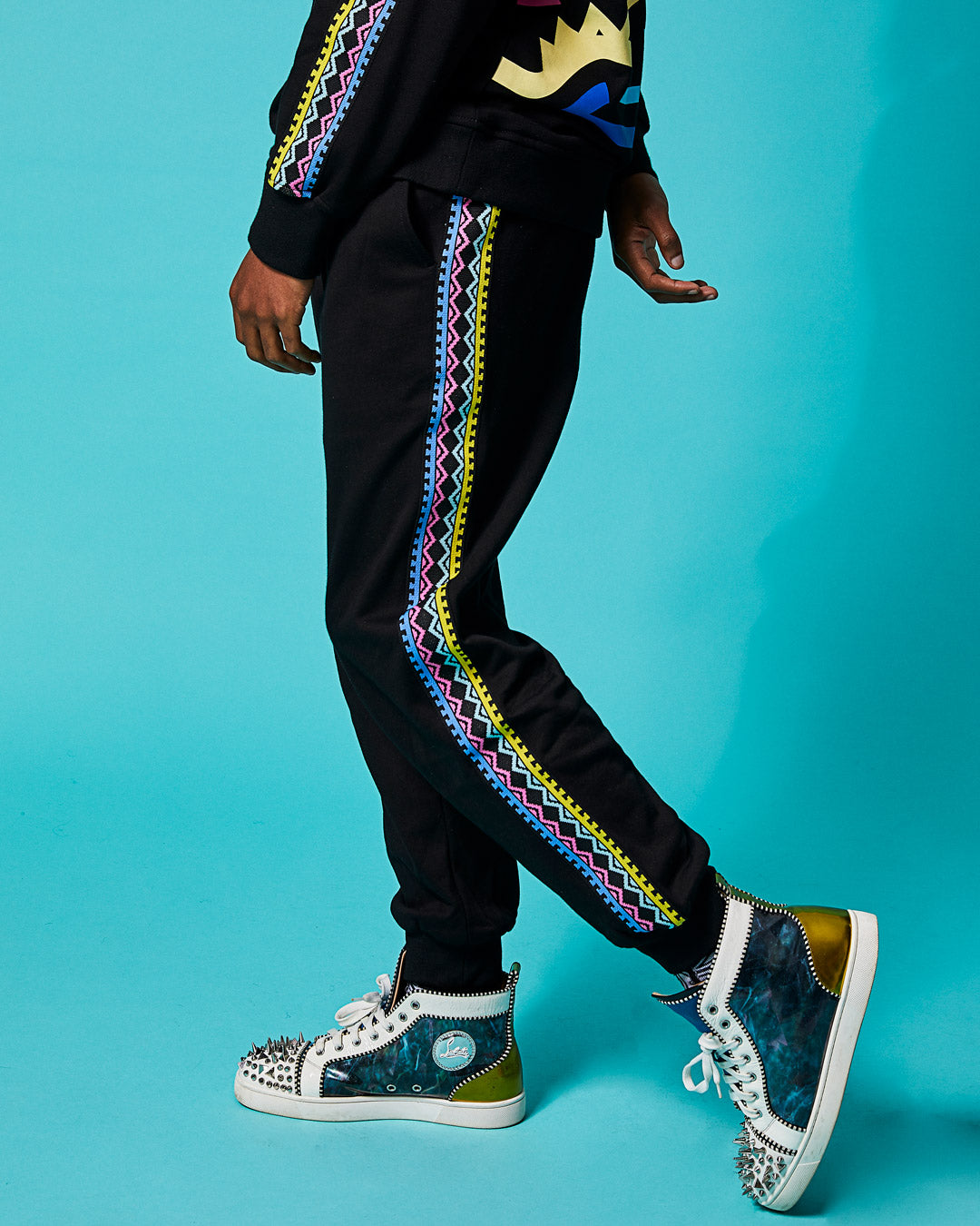 Close-up of mens designer joggers showing cargo pockets and ribbed cuffs