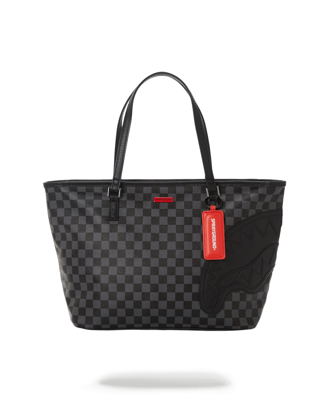Sprayground leopard print bag tote held by a model in urban setting