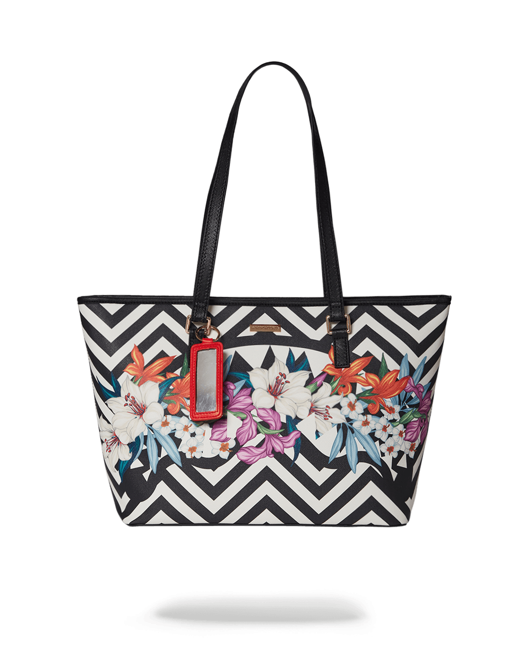 Sprayground Printed Tote Bag displayed on a shoulder, highlighting the unique print design