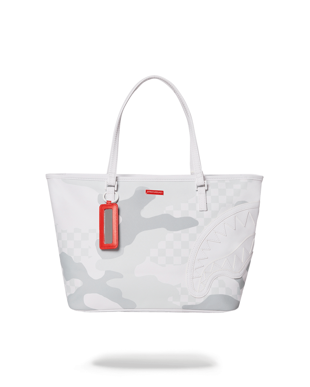 Sprayground vegan leather tote bag held against urban backdrop