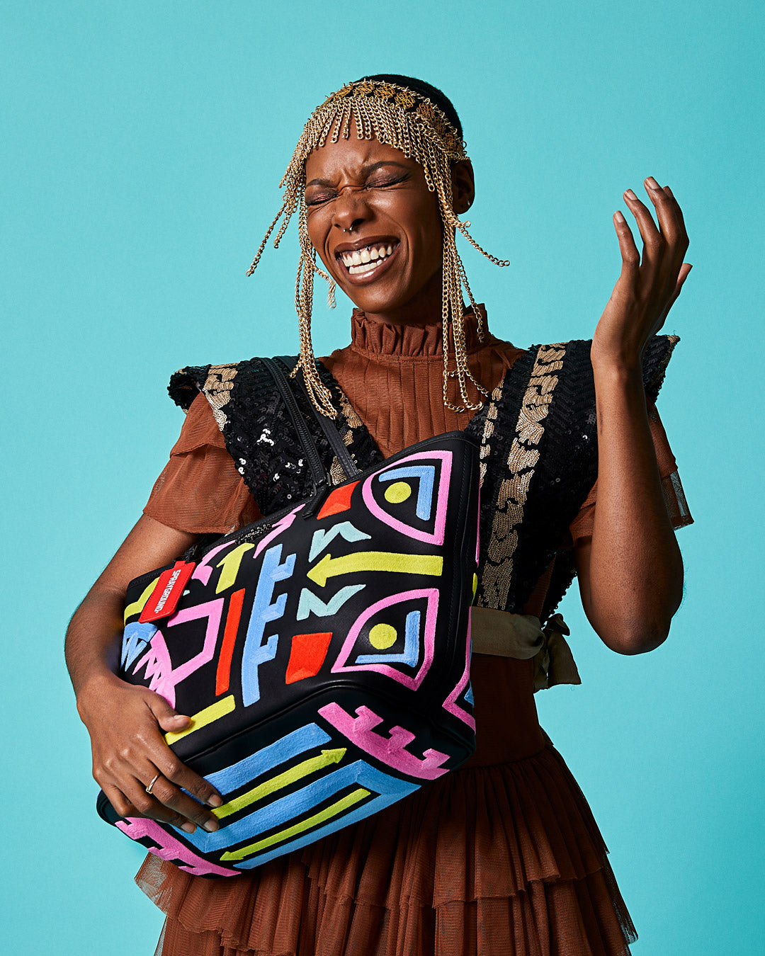 Faux leather tote bag with vibrant African print, perfect for women looking for a stylish and spacious bag.
