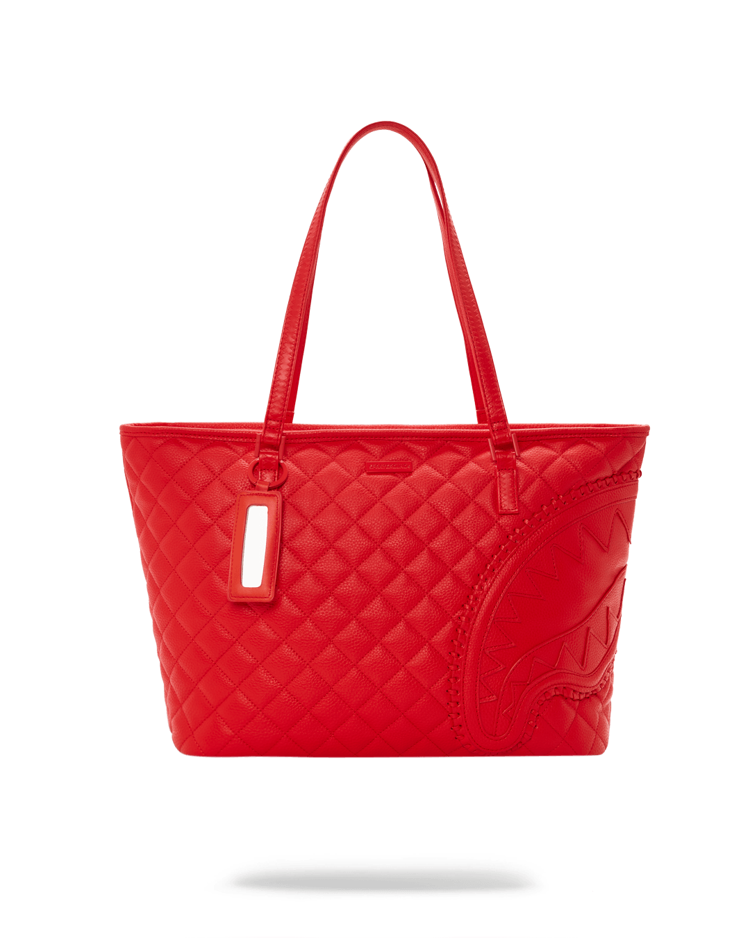 Close-up of the red vegan leather tote with quilted pattern and gold hardware