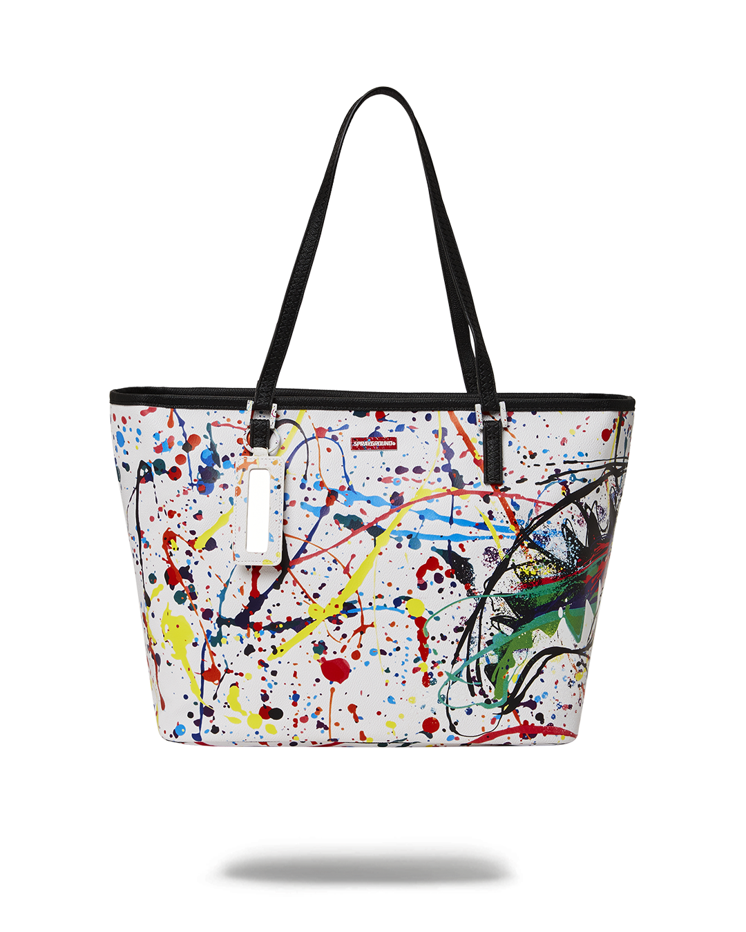 Sprayground Spark tote bag held over the shoulder in an urban setting