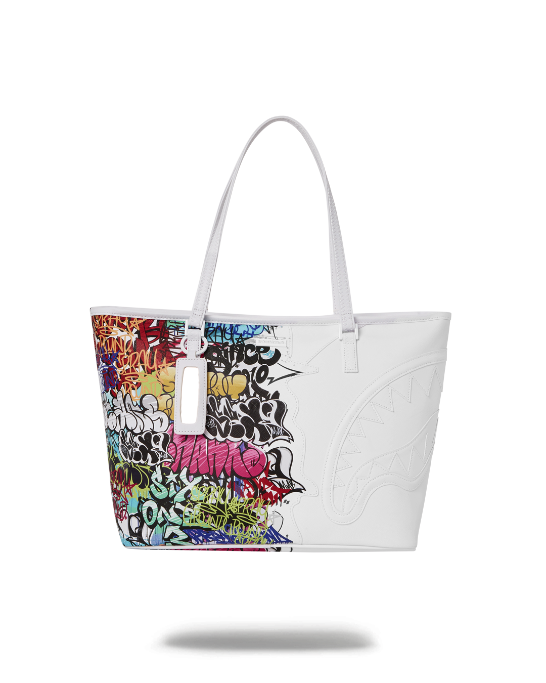 Sprayground Half Graff tote bag in use, packed with books and a laptop for work