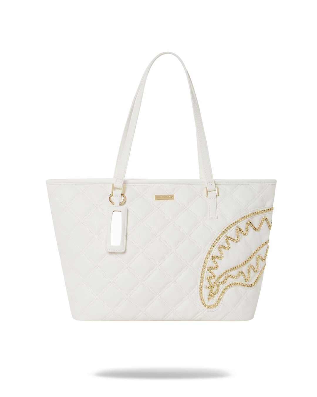 Close-up of the shark print tote bag highlighting the gold chain applique and quilted design
