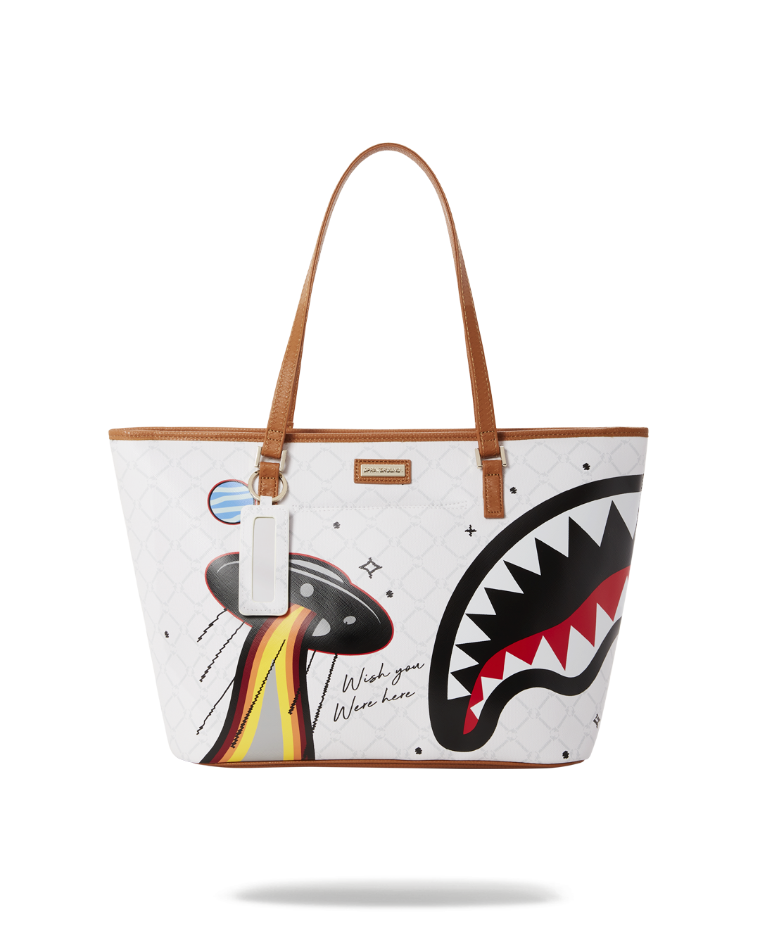 Sprayground Flying Colors vegan leather tote bag held by handle, showcasing vibrant print