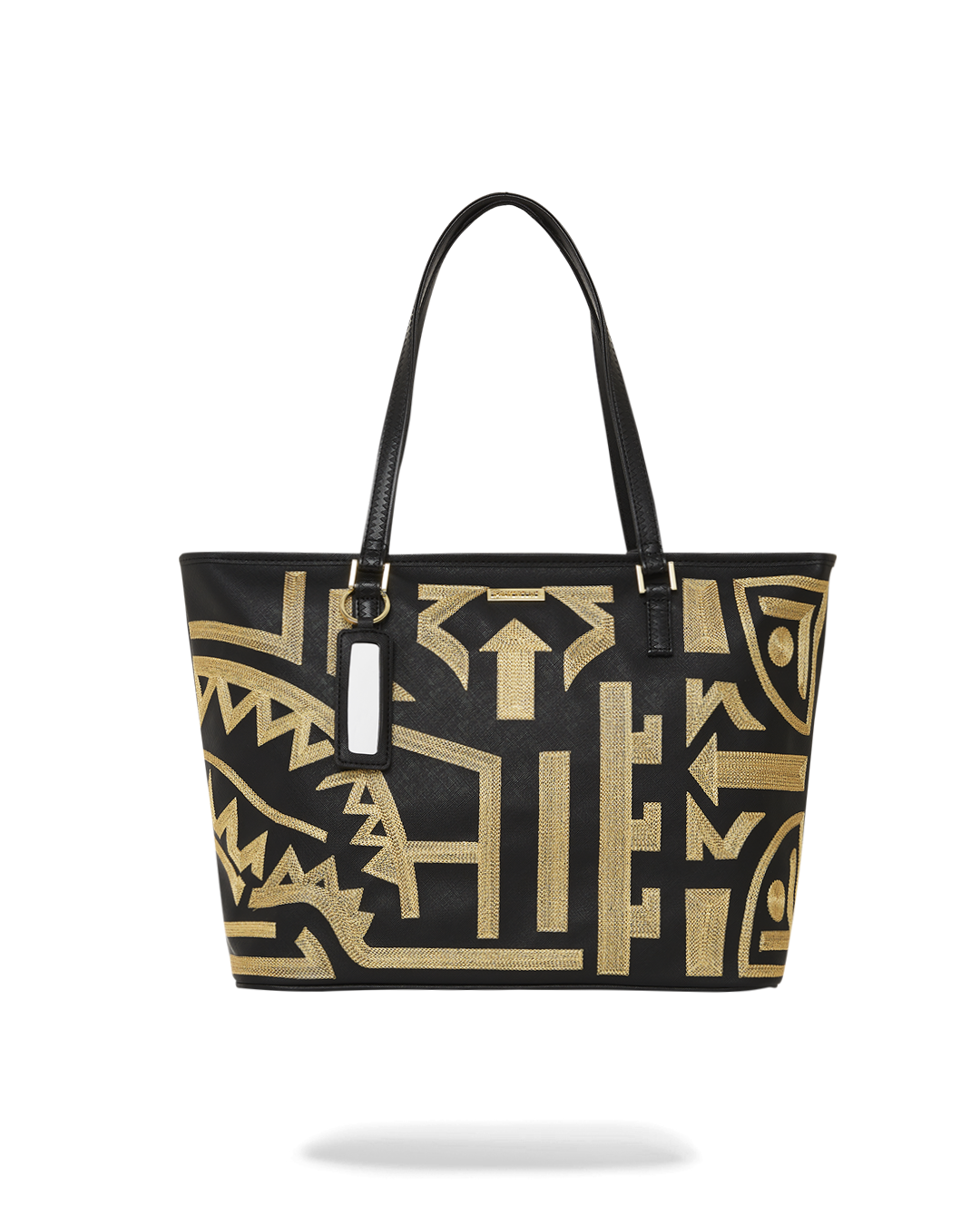 African Intelligence Tote hanging from a café chair with laptop visible inside