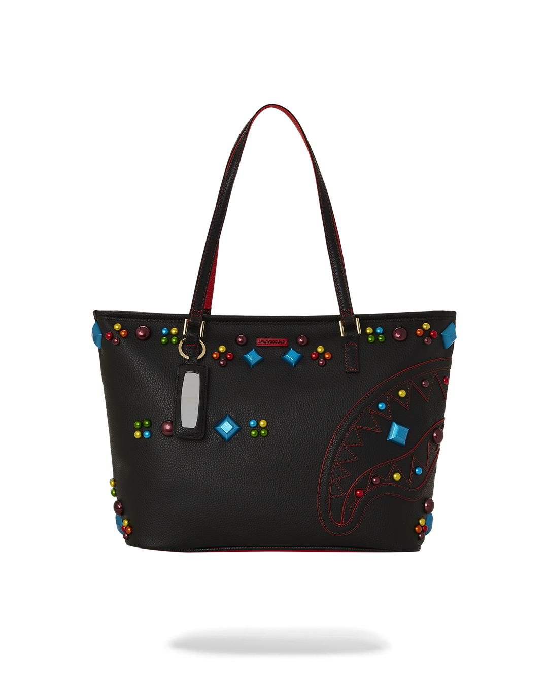 Side view of the shoulder bag showing sharkmouth detailing with enamel studs