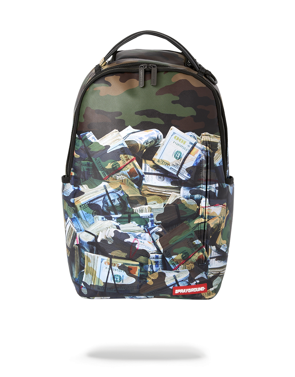Sprayground Tough Money backpack in pink, worn casually over one shoulder in an urban setting
