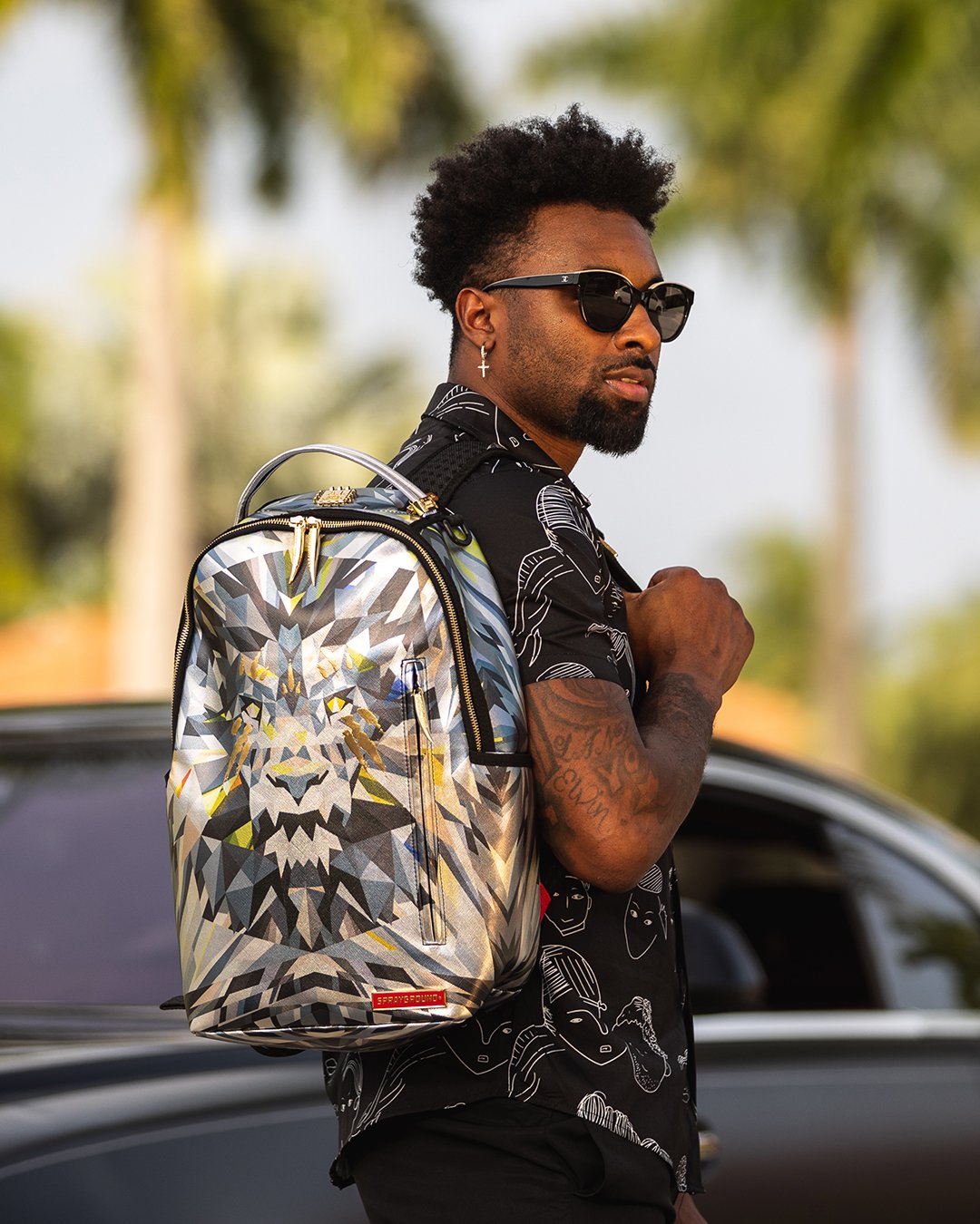 Vegan leather backpack with lion design and front zipper pocket for travel and daily use